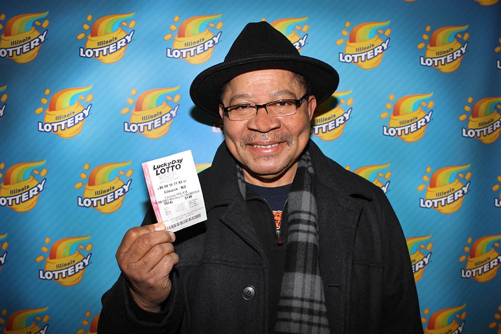 Jimmy Darling holds his winning Lucky Day Lotto ticket.