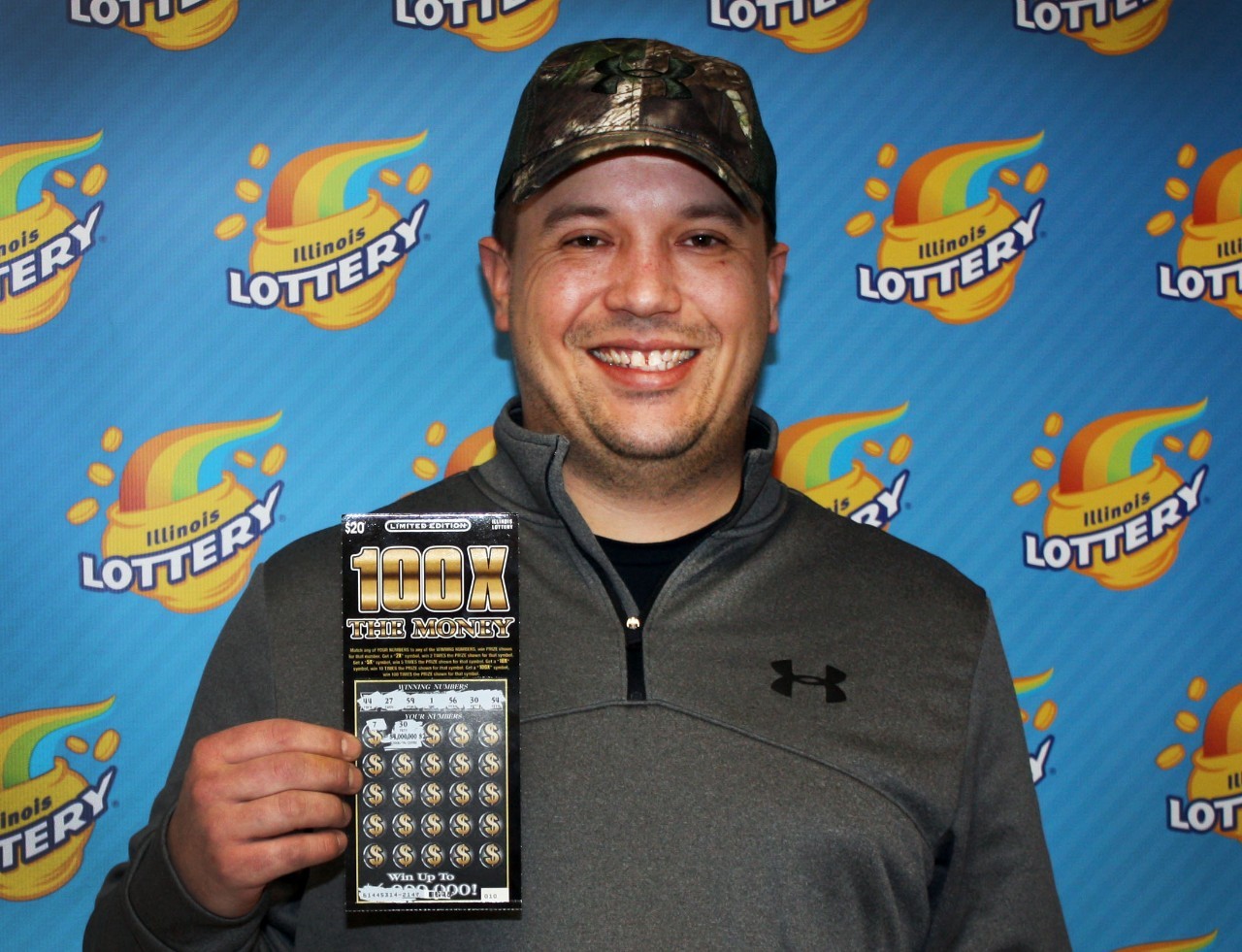 Charles Dickhaut holds his winning 100X The Money ticket