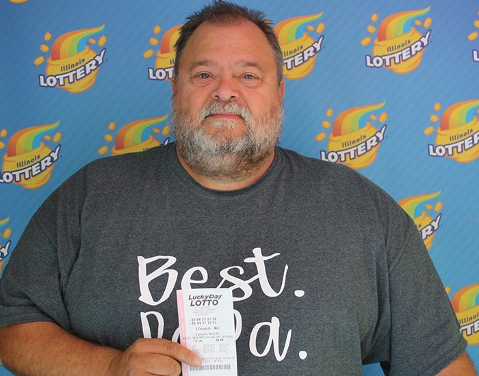 Charles Herring holds his winning Lucky Day Lotto ticket.