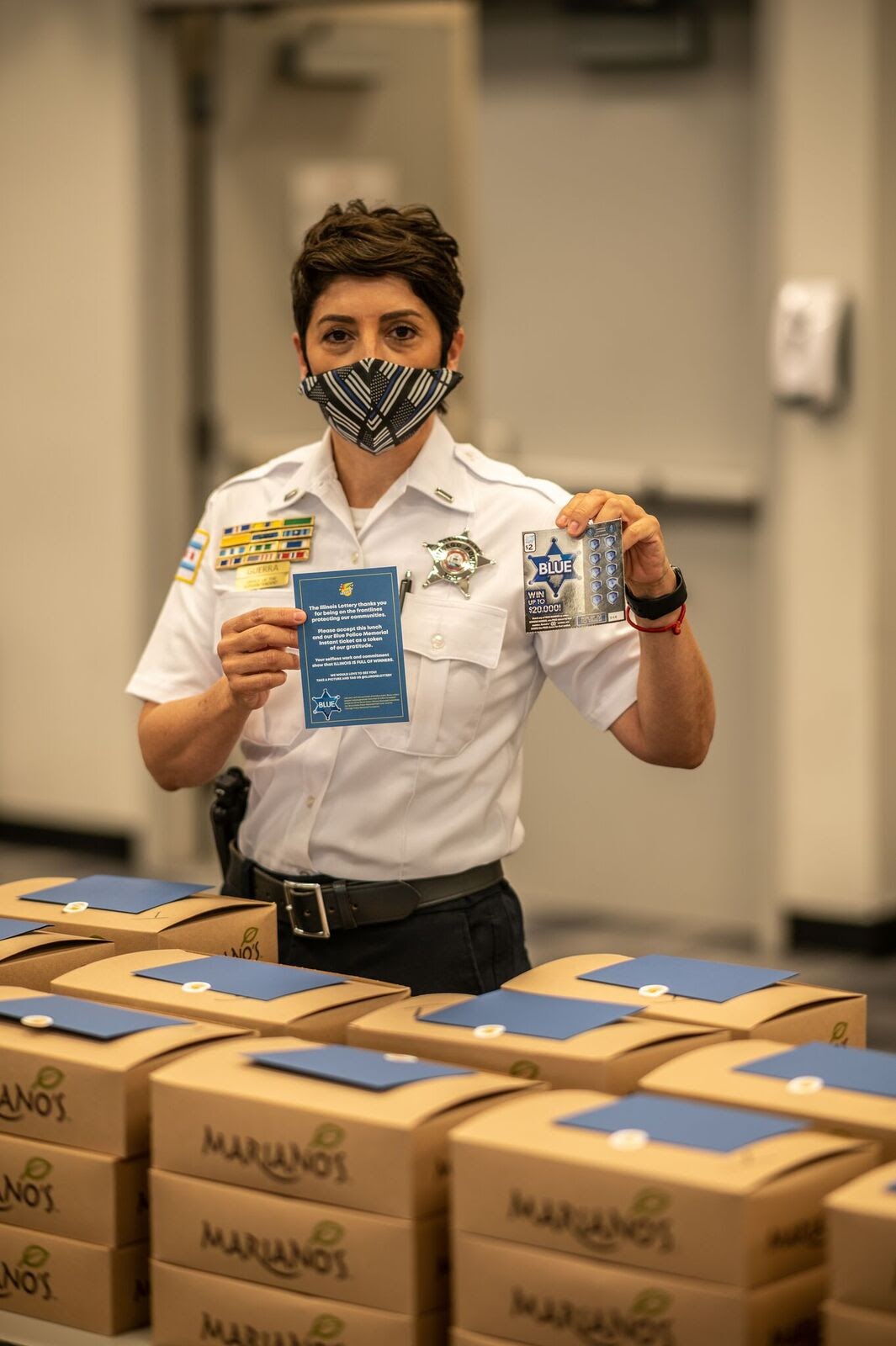 Police Officer holding Blue Police Memorial instant ticket